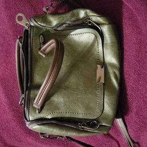 Dark green with brown straps.